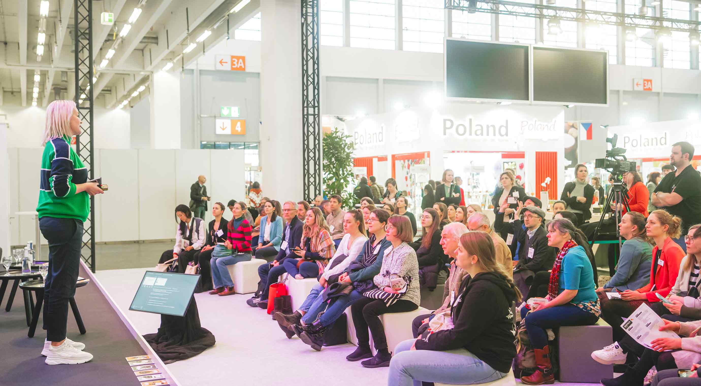 A speaker on the Innovation Stage talking to the audience