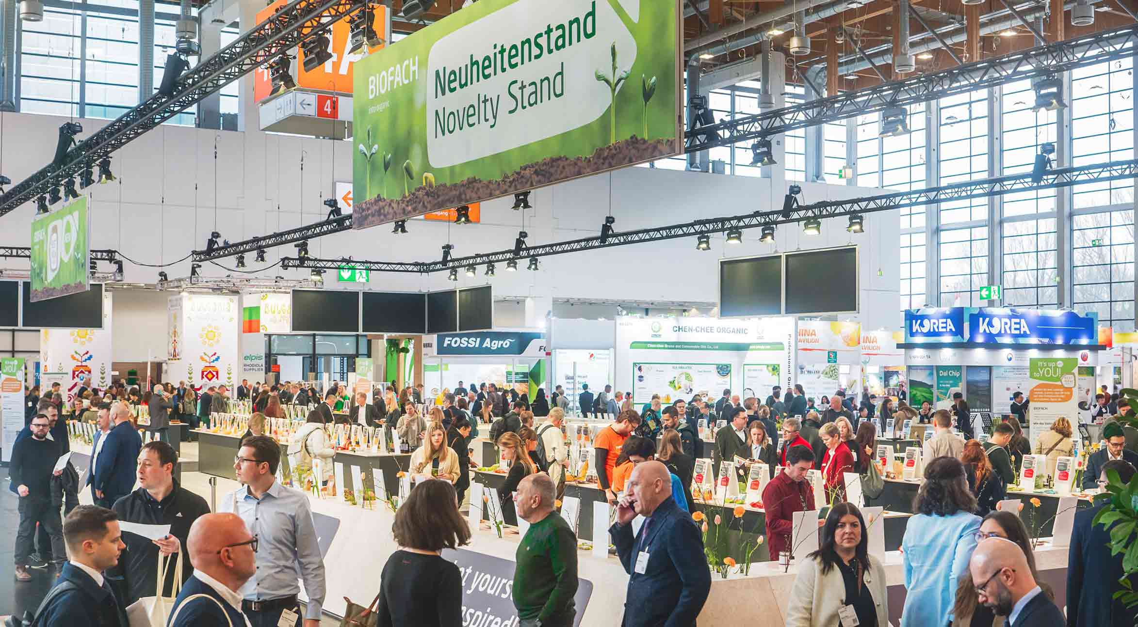 Photo of the lively novelty stand filled with visitors.