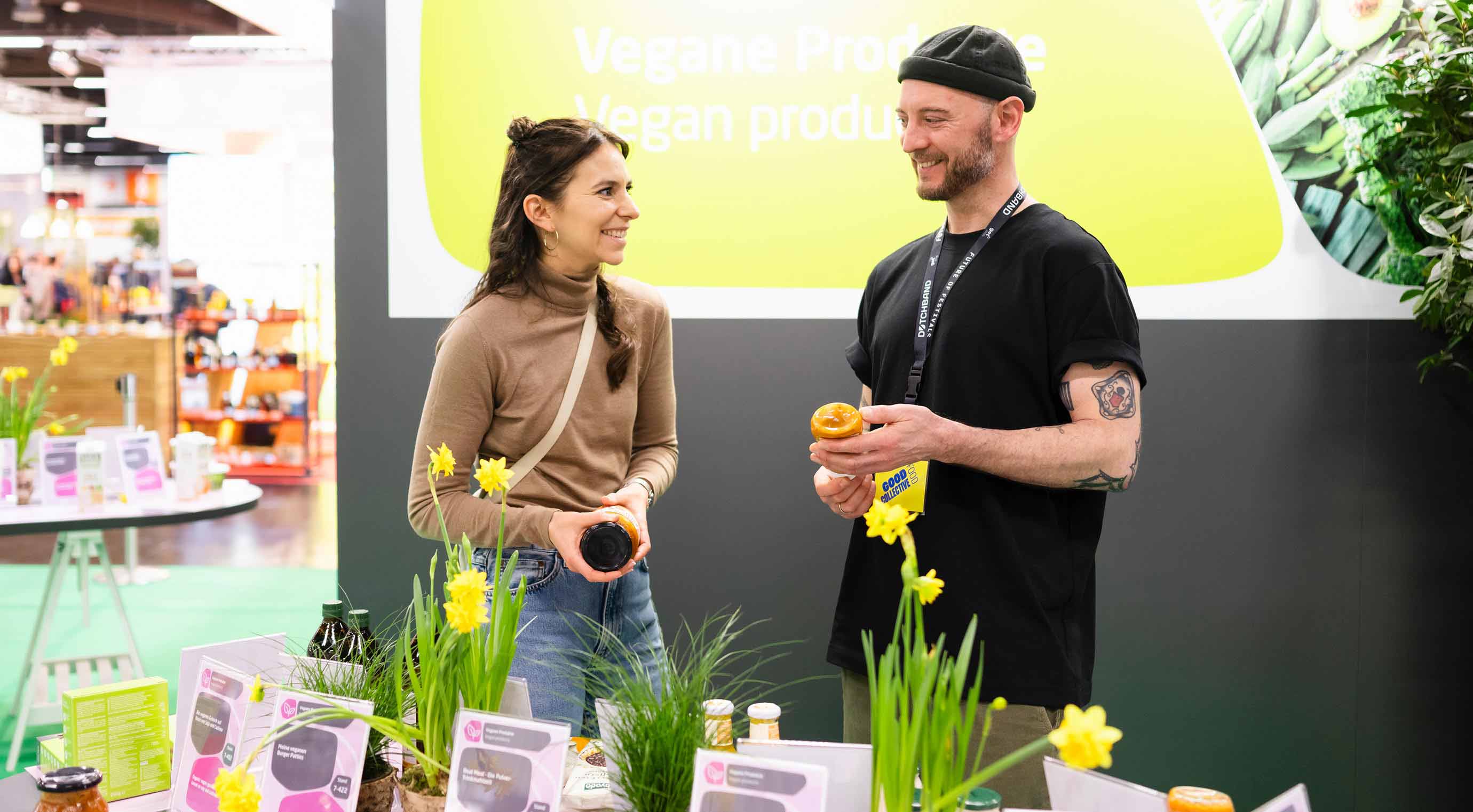 Nora and Julian from the Good Food Collective look at products in the special area Planetary Health