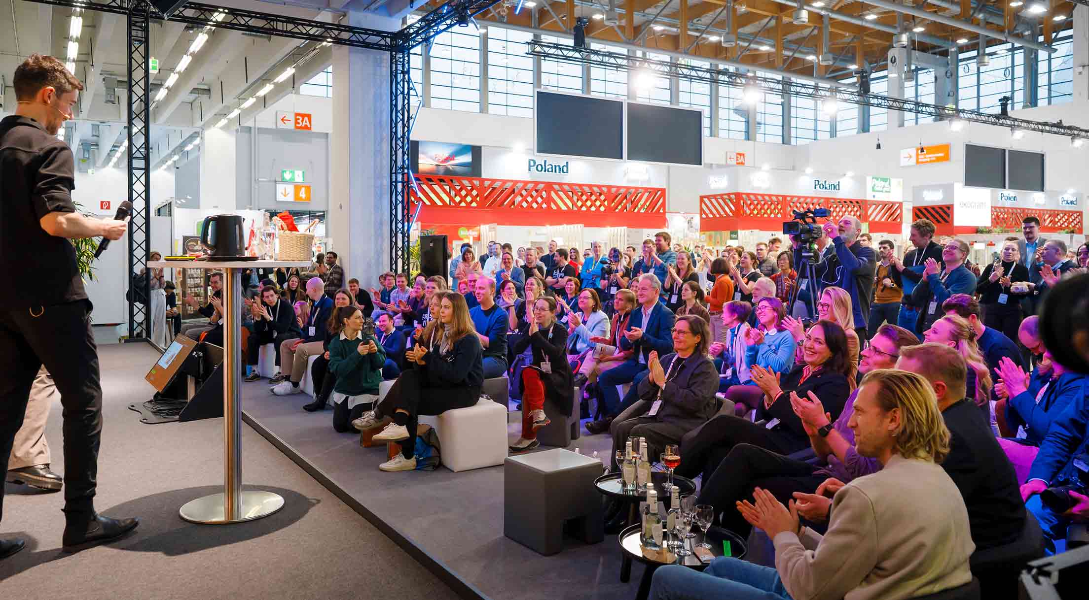 Moderator on the Innovation Stage at the start-up pitches final in front of the audience